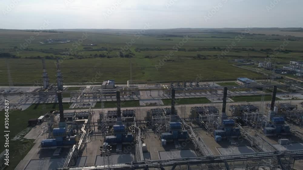 4K Aerial shot from oil tanks and towers in a refinery 4K Aerial shot from oil tanks and towers in a refinery