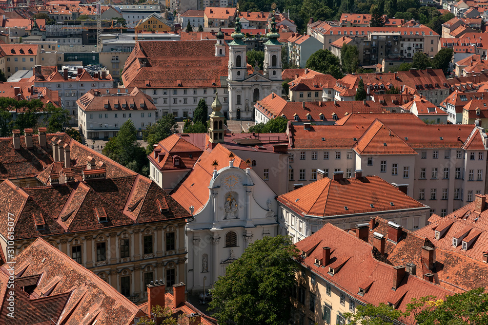 Fototapeta premium Aerial View Of Graz City Center. Church of Trinity, Mariahilfkirche, tiled roofs of city buildings
