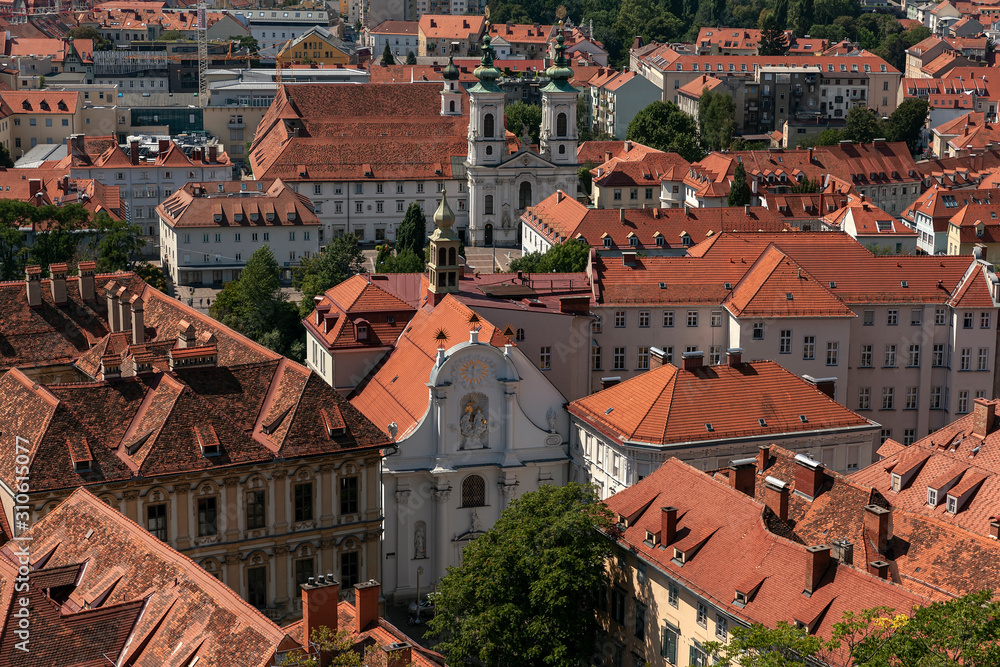 Aerial View Of Graz City Center. Church of Trinity, Mariahilfkirche, tiled roofs of city buildings