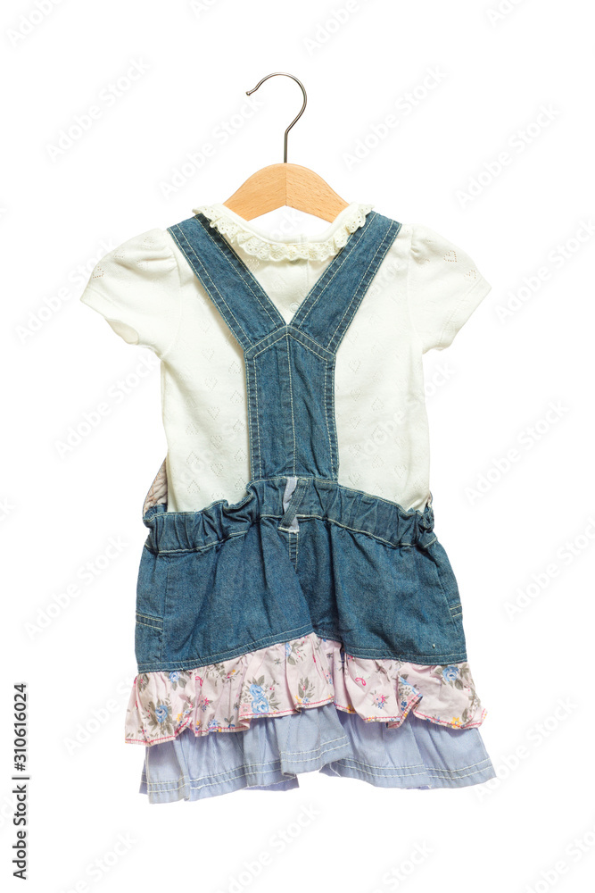 Kids blue bid Jeans dress with white shirt back view in clothes hanger, isolated on white background. Kids blue bid Jeans dress with white shirt back view in clothes hanger, isolated on white background.