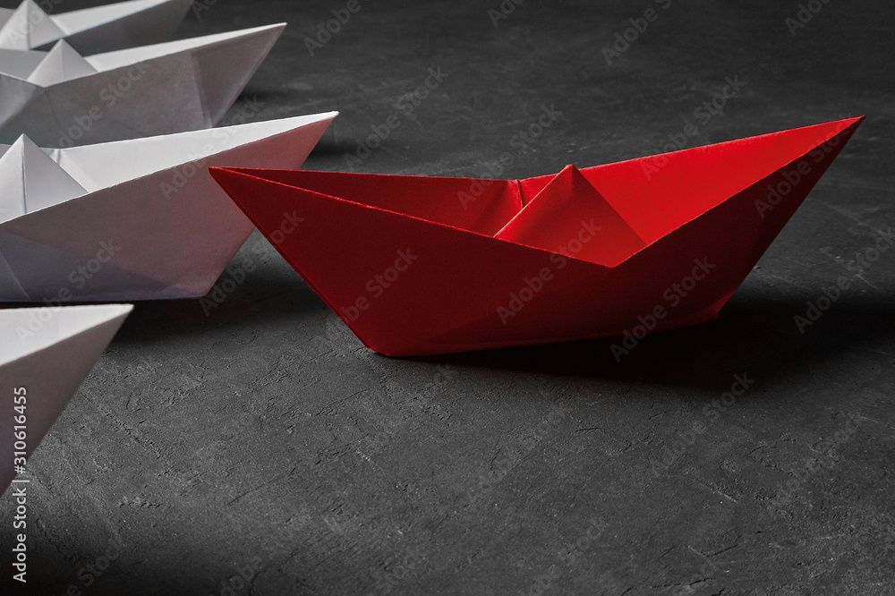 Business Concept, Paper Boat, the key opinion Leader, the concept of influence.