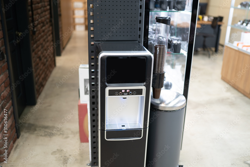 Modern electronic water cooler in the store Modern electronic water cooler in the store