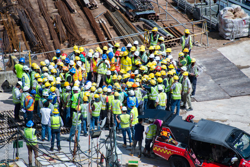 Photography Construction workers wearing helmets at a construction site learning fire fighti