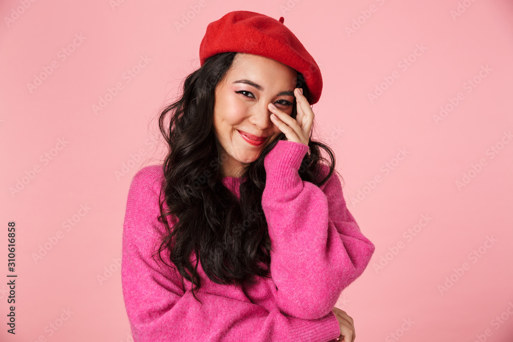 Image of shy beautiful asian girl with long dark hair in beret smiling Image of shy beautiful asian girl with long dark hair in beret smiling