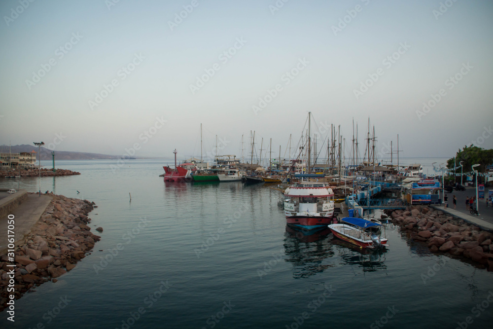 Fototapeta premium Boats in Eilat marina at sunset, Israel