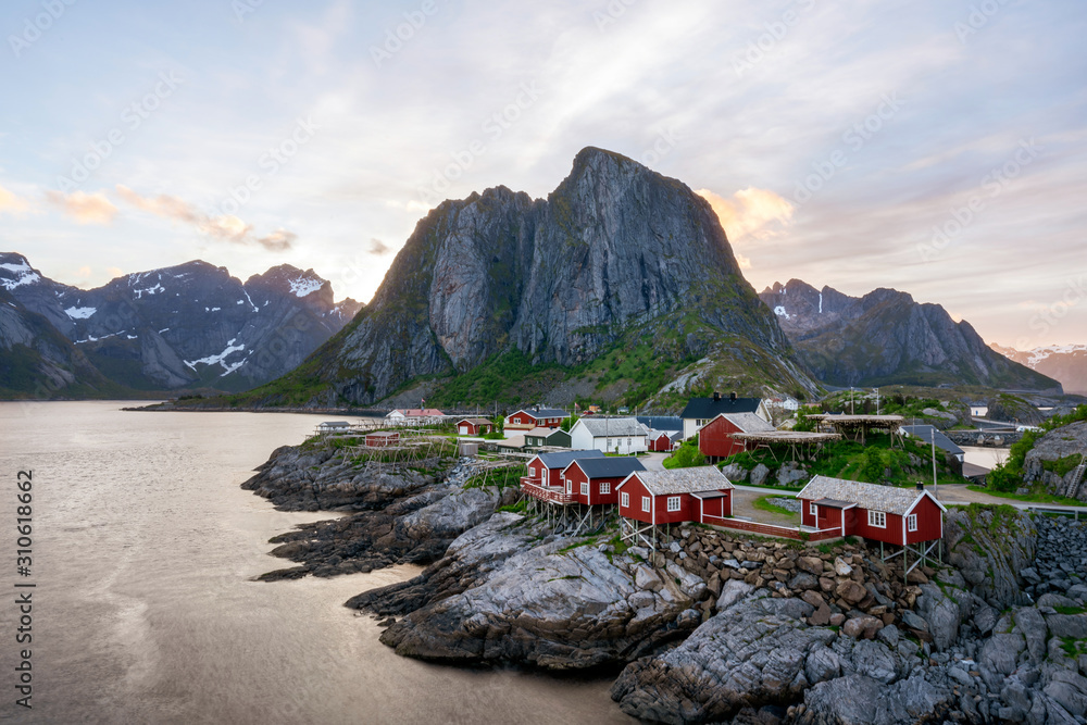 Rorbu houses on the island of Hamnoy in Lofoten, Norway during the midnight sun with calm weather and soft light..Traveling and holiday concept.
