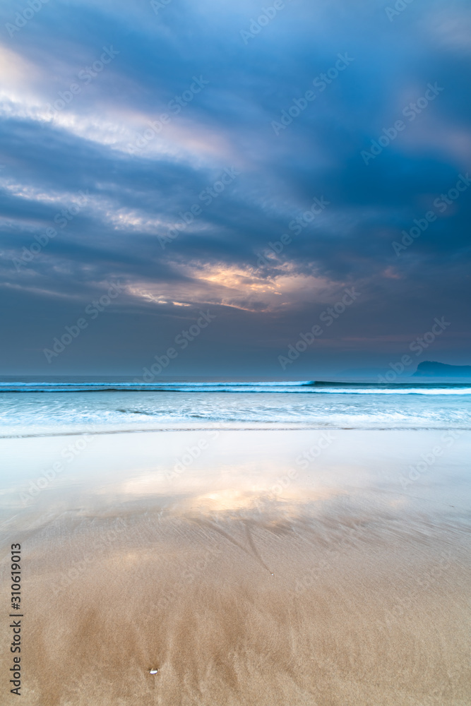 Hazy and Cloudy Sunrise Beach Reflections