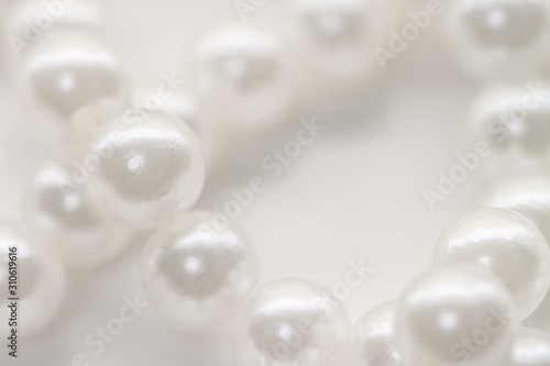 Pearl beads string jewelry isolated white background macro