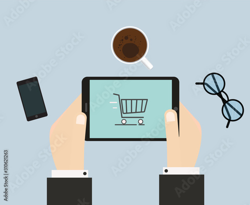 Top view of hands holding device with online shopping application.