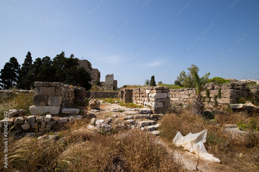 View of the Roman ruins and the Byblos Castle. Byblos, Lebanon - June, 2019