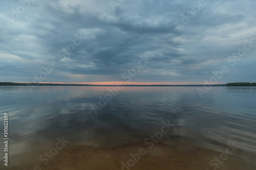 sunset and clouds over the lake © Stanislav