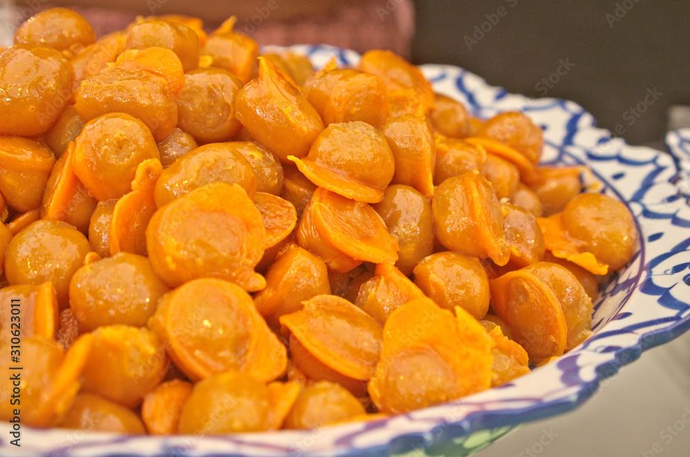 Delicious golden Thai jackfruit seed dessert recipe calls in Thai name is Khanom Med Khanoon is traditional snack dessert in Thai cuisine menu made by mung bean paste coated egg yolks in hot syrup Delicious golden Thai jackfruit seed dessert recipe calls in Thai name is Khanom Med Khanoon is traditional snack dessert in Thai cuisine menu made by mung bean paste coated egg yolks in hot syrup