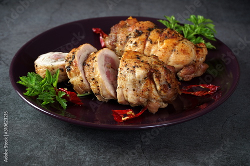 Fotografie Chicken roll on a dark plate. Healthy diet
