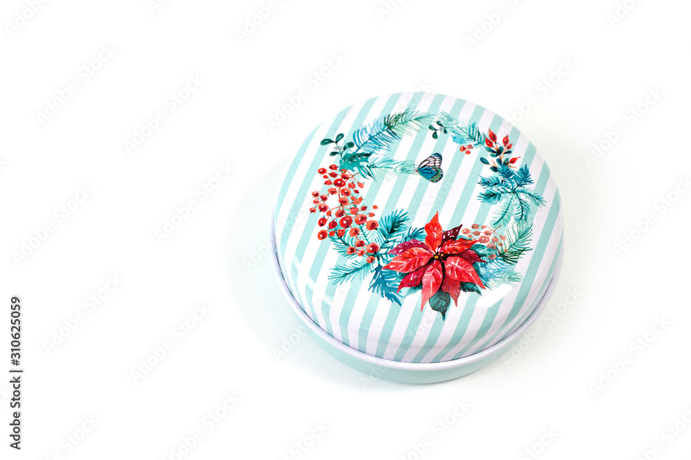 Round metal box for jewelry and small items with a lid, a delicate pattern is drawn on the lid