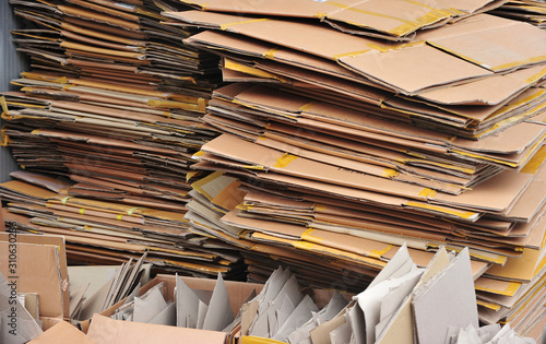 Flattened cardboard boxes being recycled