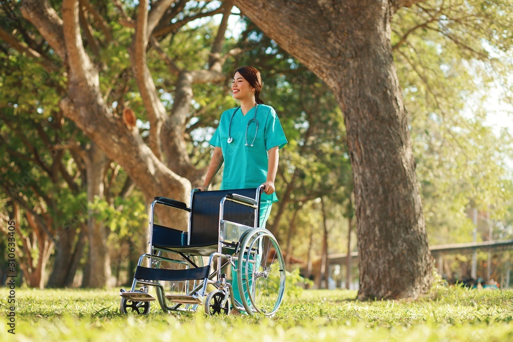 Nurse with wheelchair in the hospital park. Nurse with wheelchair in the hospital park.