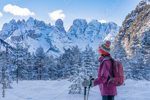 active senior woman snowsho...