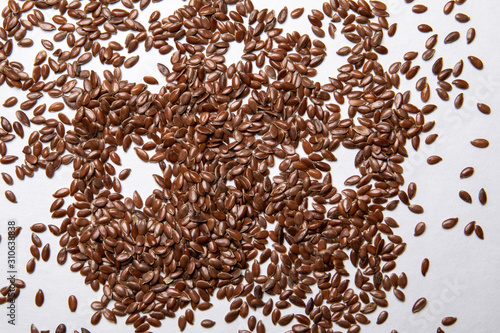 Linseeds on a white background. Nutrition source and vitamins © STOATPHOTO