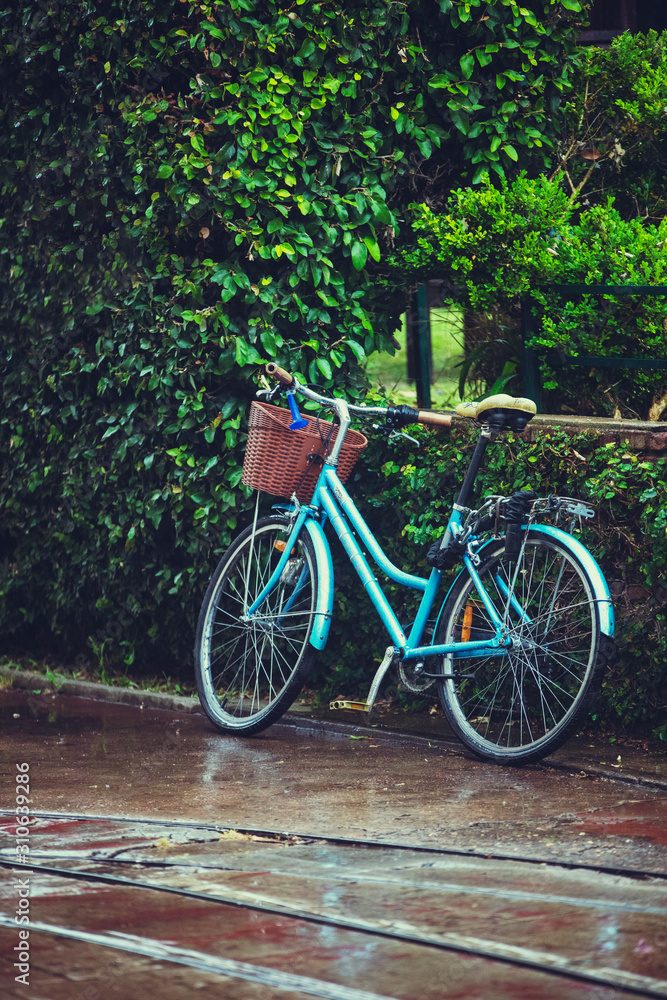 Old bicycle under the rain
