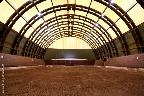 View in an indoor riding hall for horses and riders