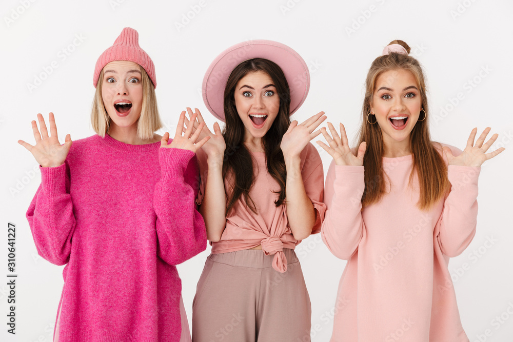 Image of three delighted young girls screaming and raising hands Image of three delighted young girls screaming and raising hands