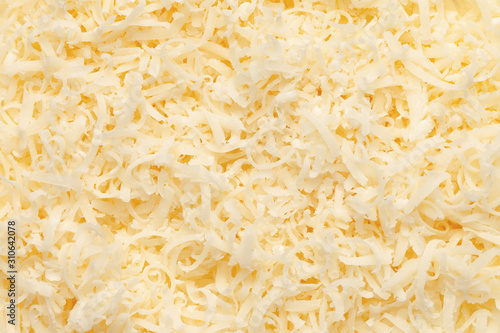 Grated parmesan cheese texture. Top view.