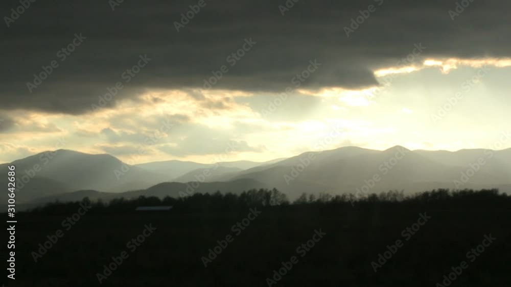 mountain with imposing clouds and bright sun, time lapse mountain with imposing clouds and bright sun, time lapse