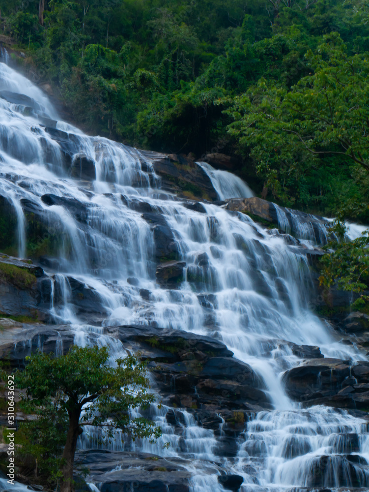 Mae ya waterfall with moss and rocks located in Chiang mai, Thailand.