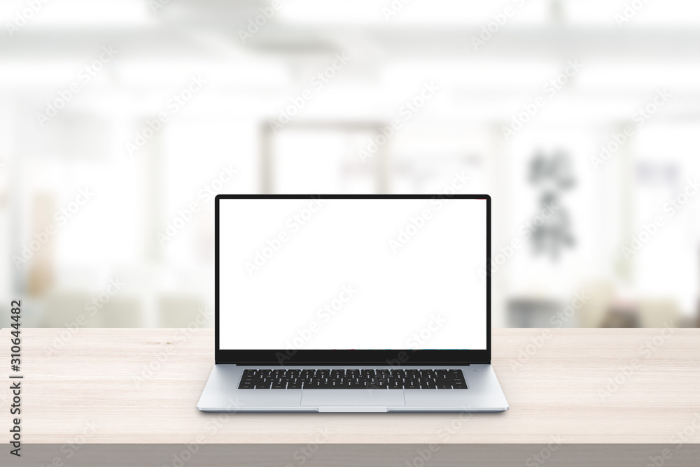 Fototapeta premium Laptop mockup on office desk. Isolated screen for mockup, app or web site presentation