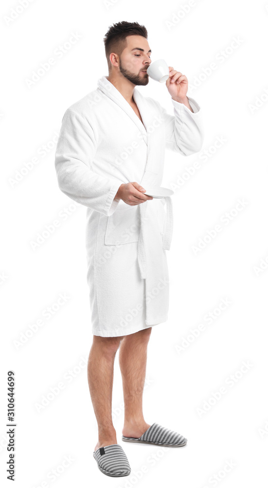 Handsome man in bathrobe drinking coffee on white background Handsome man in bathrobe drinking coffee on white background