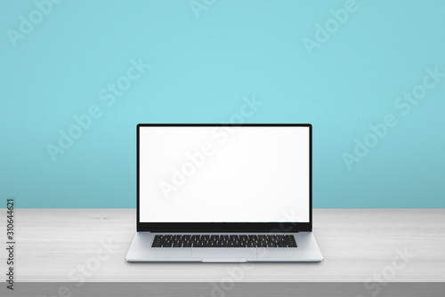 Laptop on desk. Isolated scree for mockup. Blue background