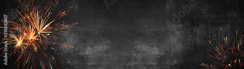Silvester background banner panorama long- firework on rustic dark black grey stone concrete texture, top view with space for text