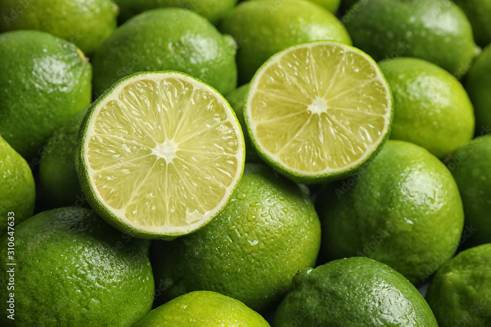Fresh ripe juicy limes as background, closeup Fresh ripe juicy limes as background, closeup