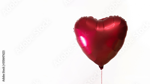 Heart shaped balloon on a white background. The concept of love and Valentine's Day.