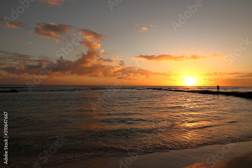 Beautiful crimson red sunset from the beach over the Caribbean Sea in Barbados, Atlantic Ocean © Alberto Vezendi