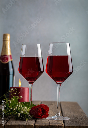 Two Glasses of Wine and Red Rose