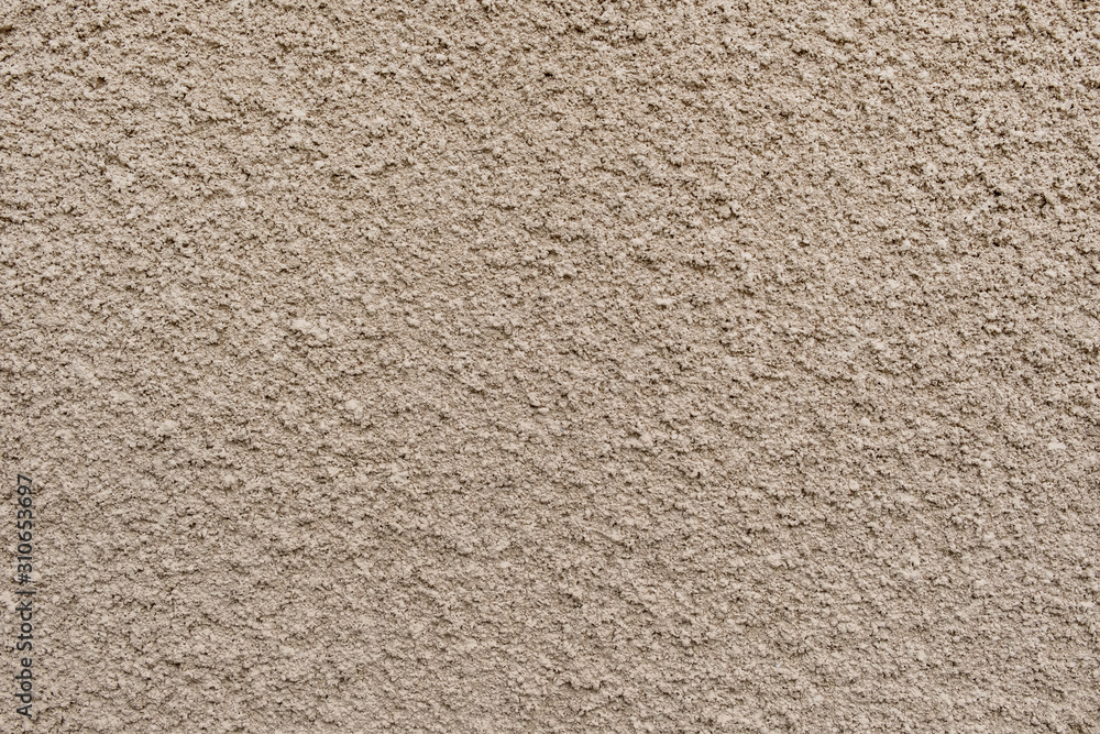 Background, stucco on the wall, homogeneous surface, light brown. Textured surface, the basis for design. Background, stucco on the wall, homogeneous surface, light brown. Textured surface, the basis for design.