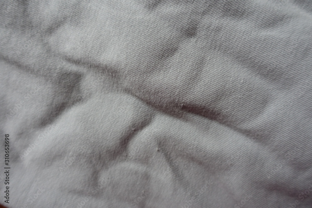Light grey jammed cotton fabric from above Light grey jammed cotton fabric from above