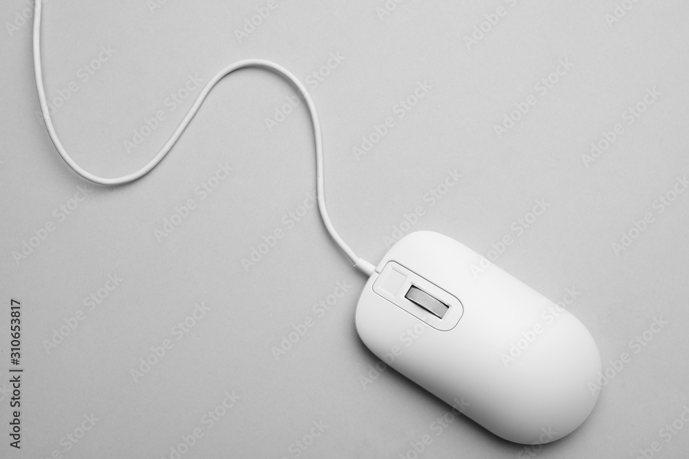 Wired computer mouse on light grey background, top view Wired computer mouse on light grey background, top view