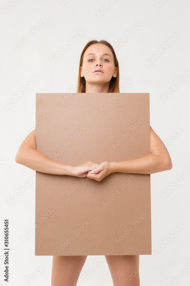 naked woman with billboard over white. nude woman holding copy space naked woman with billboard over white. nude woman holding copy space