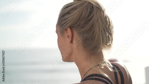 Woman looking over ocean.