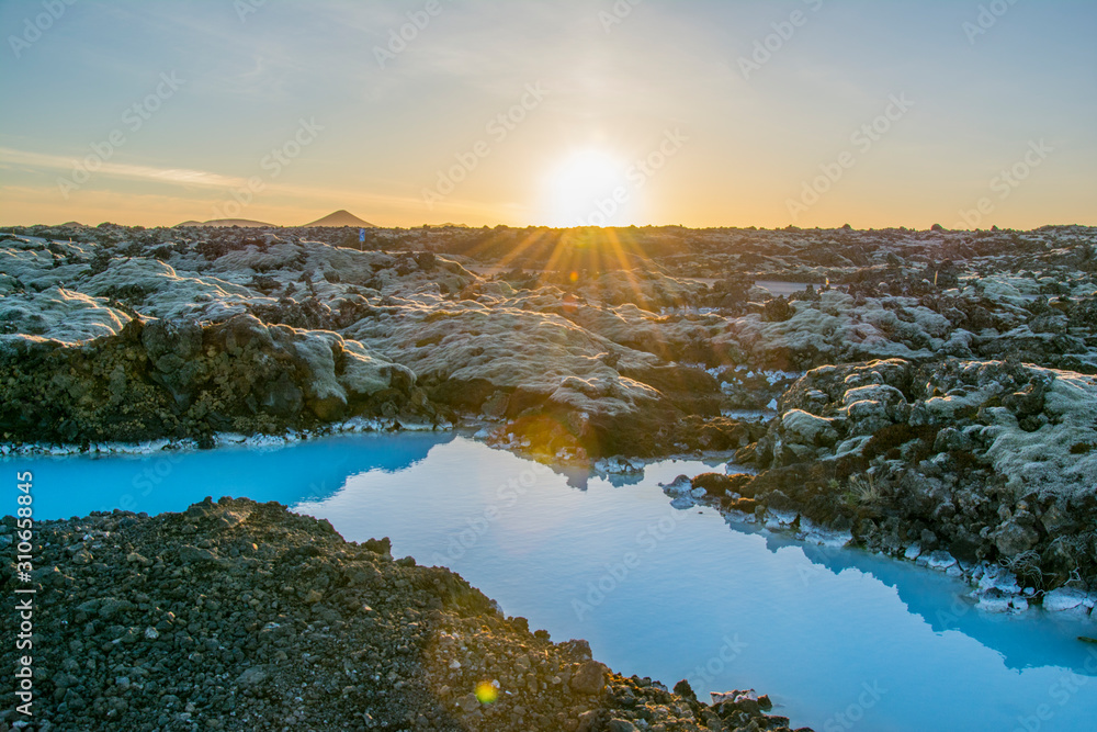 Iceland blue water and rocky landscape in the sunset