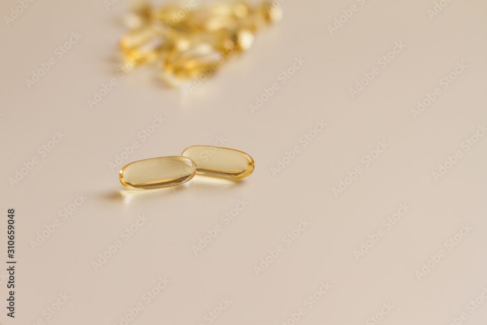 omega vitamins in capsules on a white background. a handful of vitamins in tablets for human health. concept of medicine and health. space for text. the view from the top.