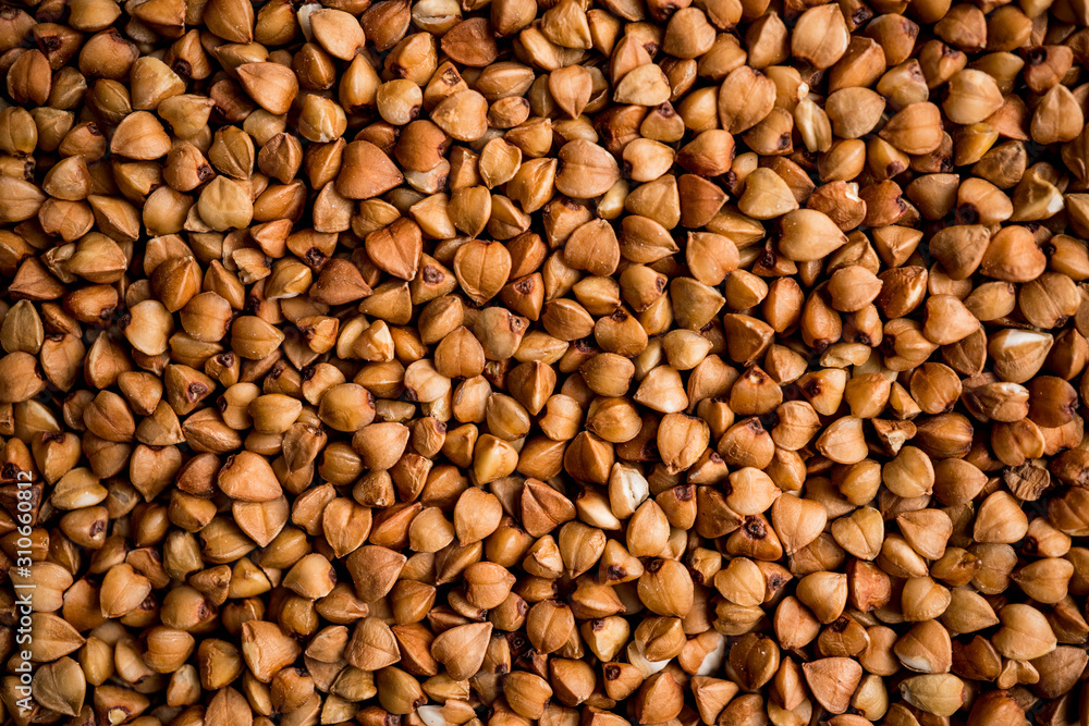 The texture of dry buckwheat. Background image of buckwheat porridge. Maro's Photo The texture of dry buckwheat. Background image of buckwheat porridge. Maro's Photo