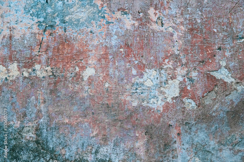 Creative abstract texture background. Beautiful turquoise, red and grey grunge rough artistic old stone wall with cracks and scratches. Copy space 