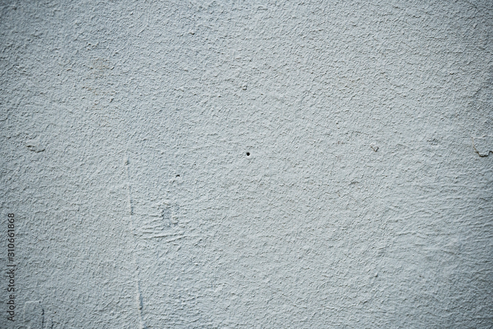 Texture of an old wall covered with paint. Background image of a worn paint coated surface