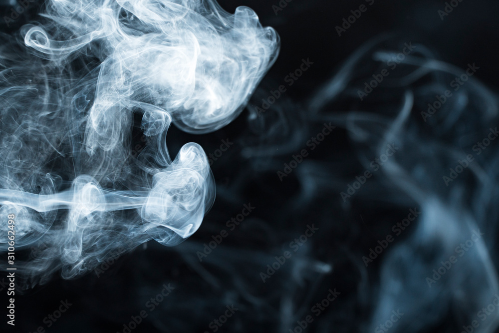 Fototapeta premium Photo of a wisp of smoke on a dark background