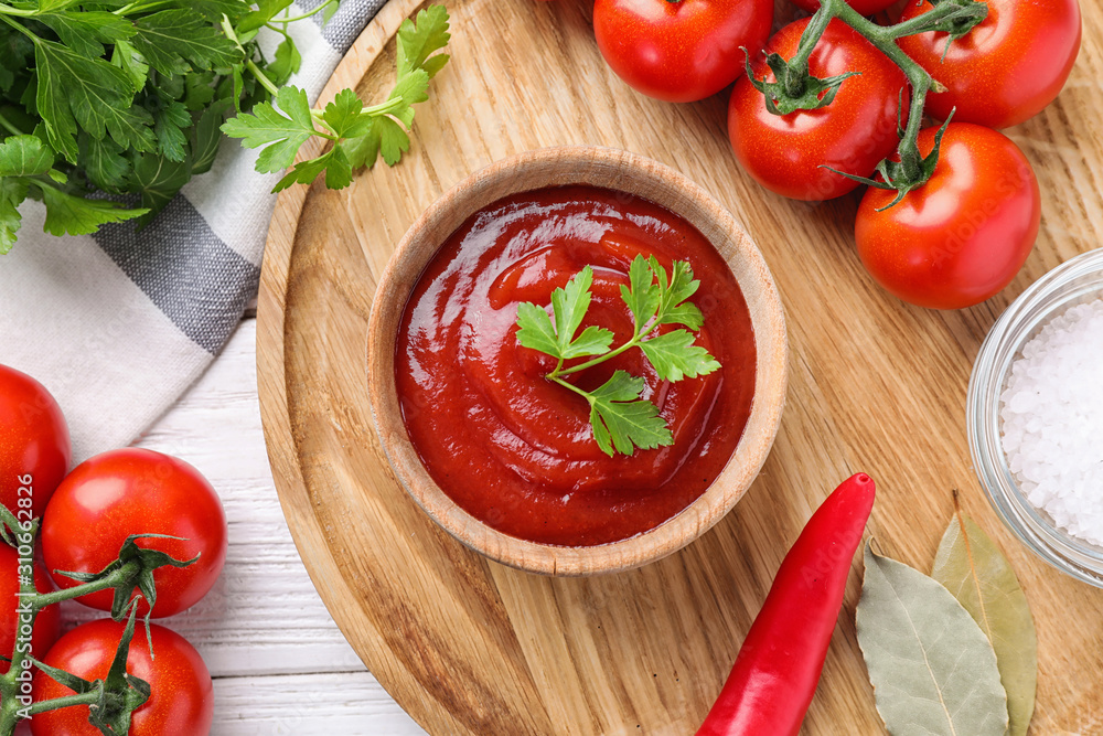 Flat lay composition with tomato sauce on white wooden table Flat lay composition with tomato sauce on white wooden table