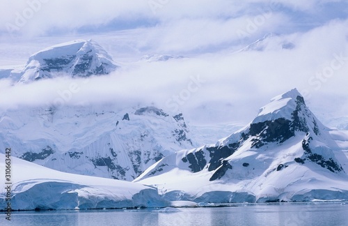 Antarctica Snow covered mountains and icebergs