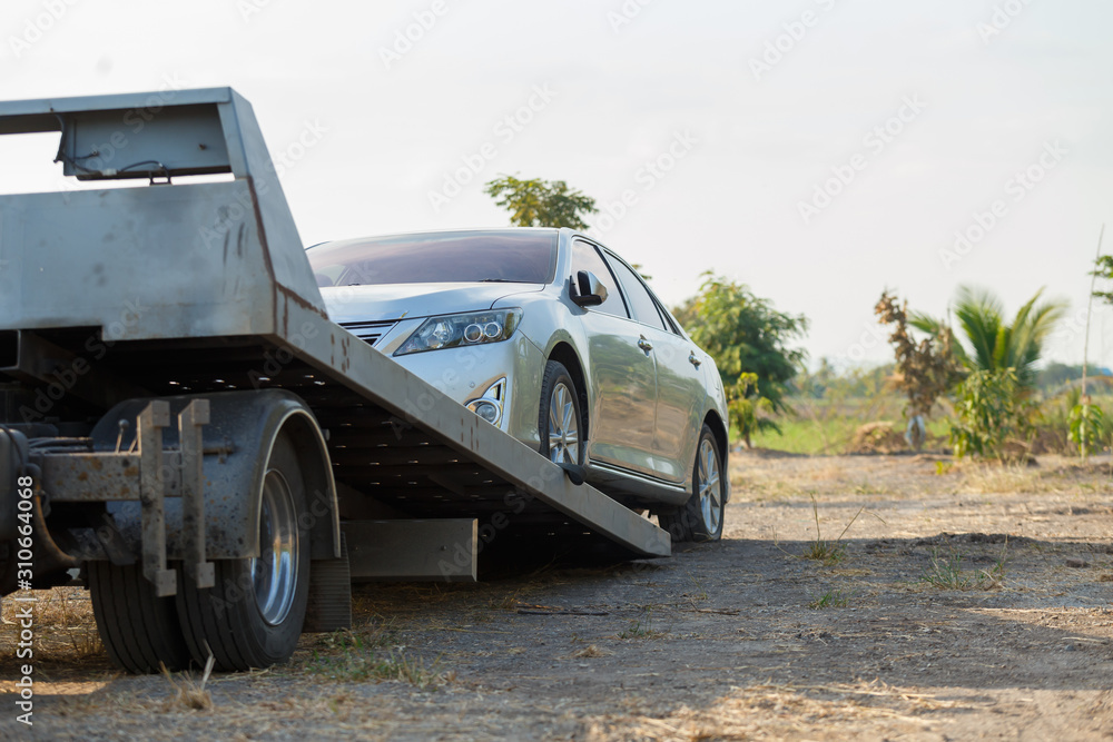 Fototapeta premium Tow car service on side for loading broken car to the garage.